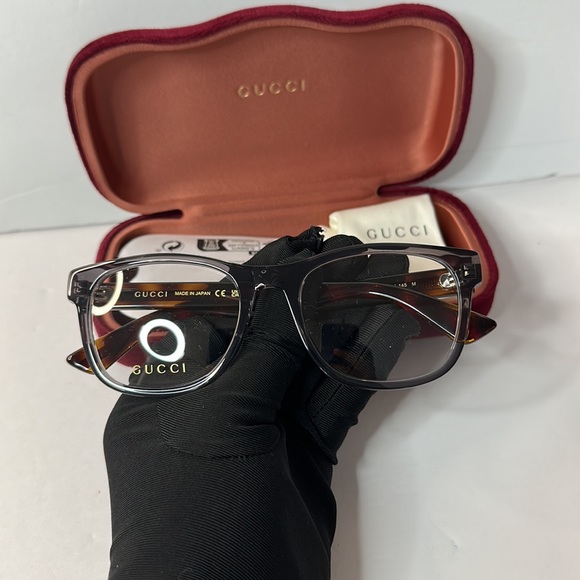 Gucci's GG0004ON soft lines across frames front.Iconic web effect optyl temples - Picture 8 of 14